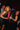 Two women celebrating at a party holding Elite Vodka bottles, capturing nightlife energy and freedom.